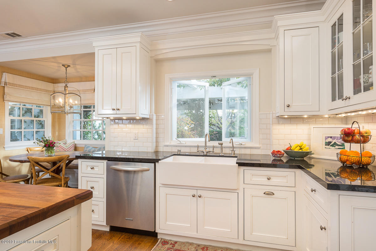 191 Sierra View Road Pasadena, CA 91105 - Photo 13 of 52 a kitchen with white cabinets and white appliances