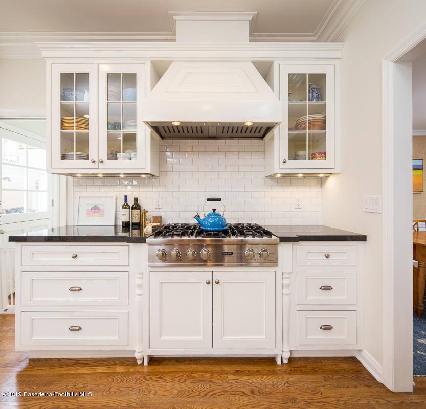 191 Sierra View Road Pasadena, CA 91105 - Photo 14 of 52 a kitchen with a stove cabinets and a window