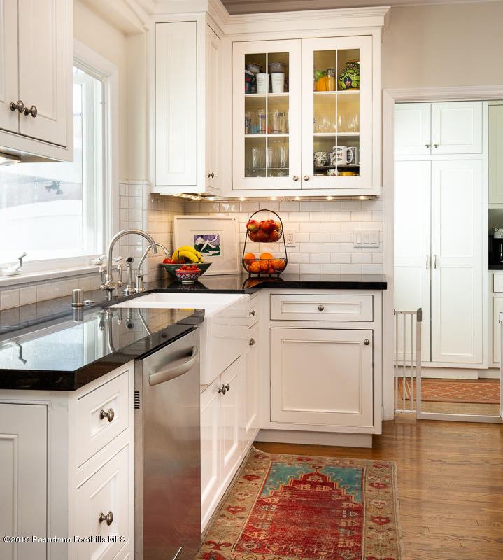 191 Sierra View Road Pasadena, CA 91105 - Photo 15 of 52 a kitchen with granite countertop a sink stove and cabinets