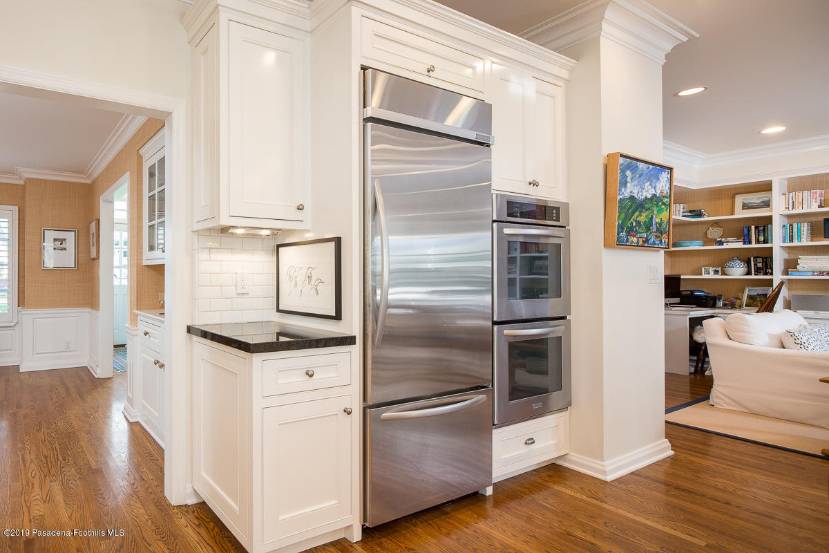 191 Sierra View Road Pasadena, CA 91105 - Photo 16 of 52 a kitchen with stainless steel appliances and white cabinets
