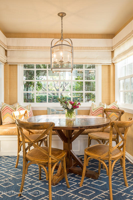 191 Sierra View Road Pasadena, CA 91105 - Photo 18 of 52 a dining room with furniture a chandelier and wooden floor