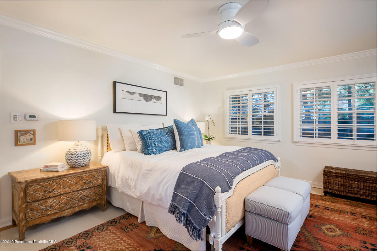 191 Sierra View Road Pasadena, CA 91105 - Photo 21 of 52 a spacious bedroom with a bed and wooden floor
