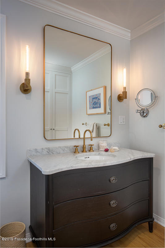 191 Sierra View Road Pasadena, CA 91105 - Photo 24 of 52 a bathroom with a double vanity sink and a mirror