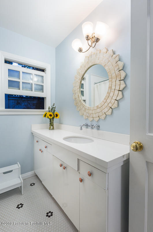 191 Sierra View Road Pasadena, CA 91105 - Photo 28 of 52 a bathroom with a sink mirror and vanity