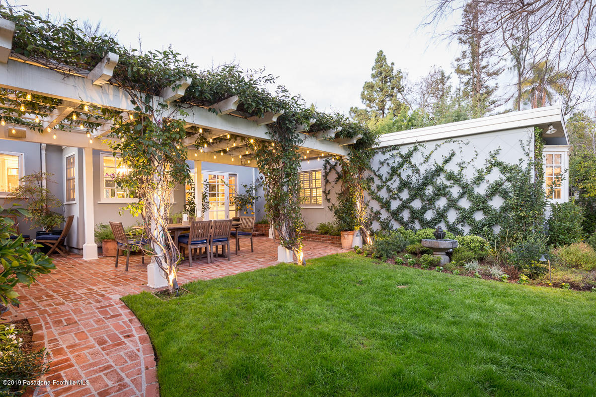 191 Sierra View Road Pasadena, CA 91105 - Photo 35 of 52 a view of a chair and table in backyard of the house