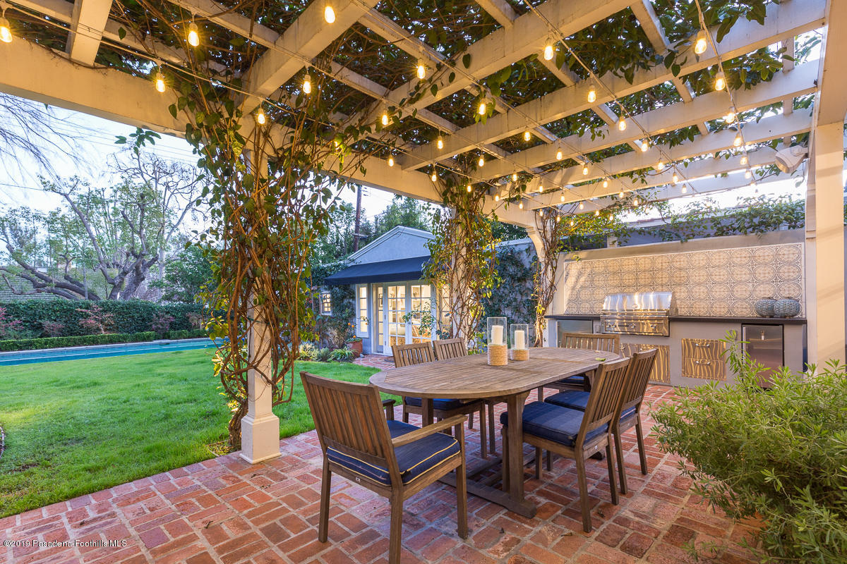 191 Sierra View Road Pasadena, CA 91105 - Photo 36 of 52 a view of a patio with a table and chairs