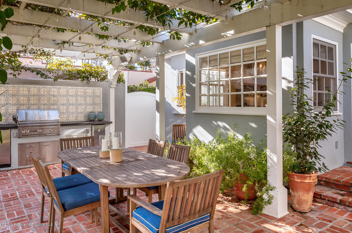 191 Sierra View Road Pasadena, CA 91105 - Photo 46 of 52 a roof deck with table and chairs potted plants
