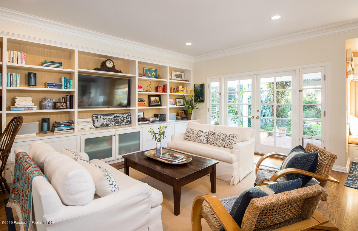 191 Sierra View Road Pasadena, CA 91105 - Photo 9 of 52 a living room with furniture a flat screen tv and a fireplace