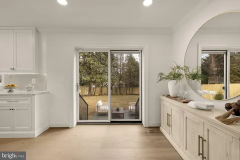 a stove top oven sitting inside of a kitchen
