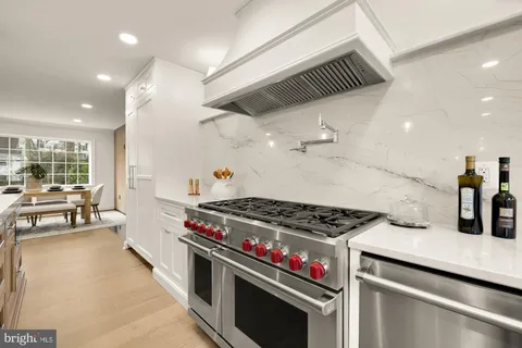 a bathroom with a sink mirror and a bathtub