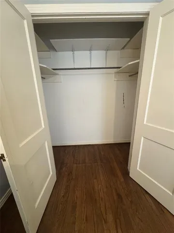 a view of washer and dryer with wooden floor