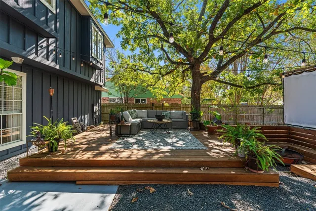 a view of a backyard with sitting area