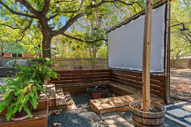 a view of a back yard of the house and a fountain