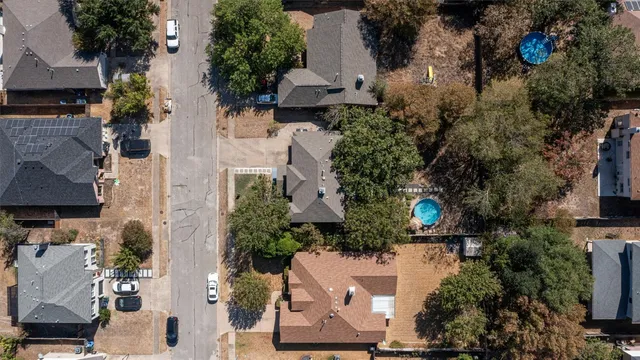 an aerial view of multiple houses with yard
