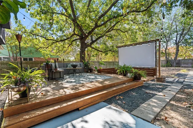 a view of a yard with cars