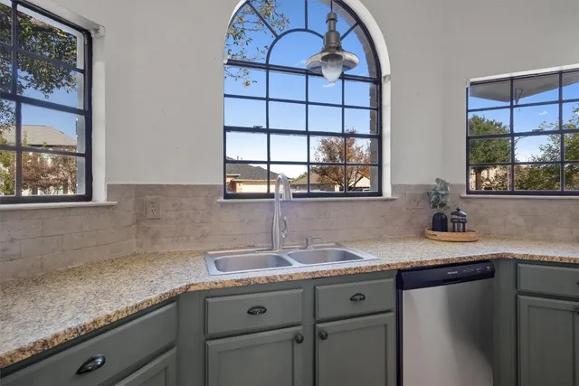 a kitchen with a sink and a window