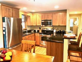 136 East Osterville Road Osterville, MA 02655 - Photo 12 of 22 a kitchen with stainless steel appliances a refrigerator sink stove microwave and cabinets