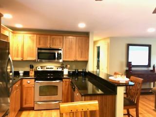136 East Osterville Road Osterville, MA 02655 - Photo 13 of 22 a kitchen with a stove a sink and a microwave