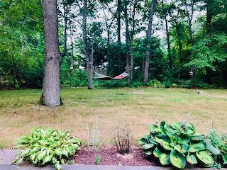 136 East Osterville Road Osterville, MA 02655 - Photo 20 of 22 a backyard of a house with lots of green space