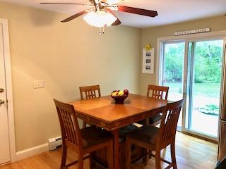 136 East Osterville Road Osterville, MA 02655 - Photo 3 of 22 a view of a dining room with a table and chairs