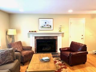 136 East Osterville Road Osterville, MA 02655 - Photo 5 of 22 a living room with furniture and a fireplace