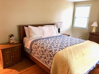 136 East Osterville Road Osterville, MA 02655 - Photo 8 of 22 a bed sitting in a bedroom next to a window