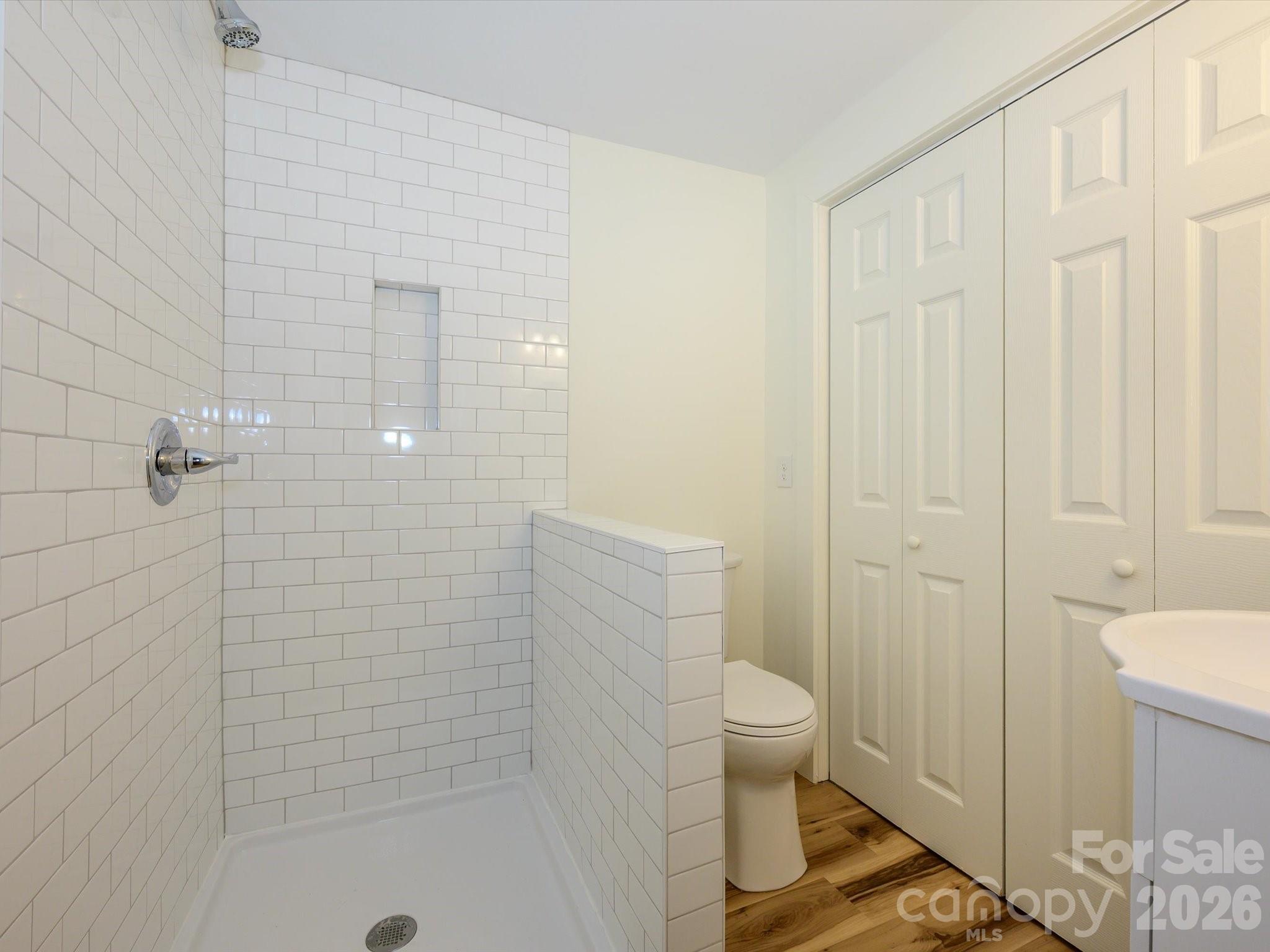 156 Hartsell School Road Southwest Concord, NC 28027 - Photo 17 of 28 a bathroom with a shower and a toilet