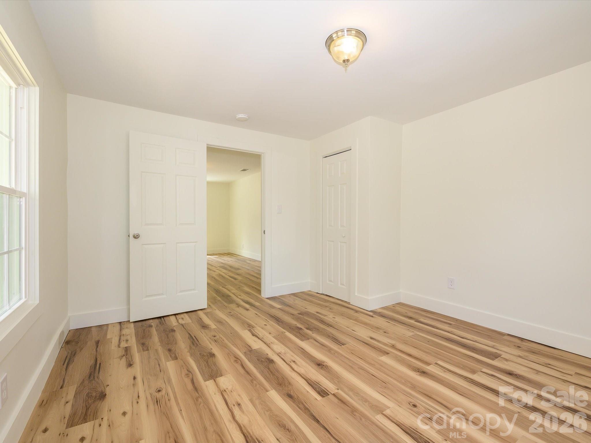 156 Hartsell School Road Southwest Concord, NC 28027 - Photo 20 of 28 a view of an empty room and window
