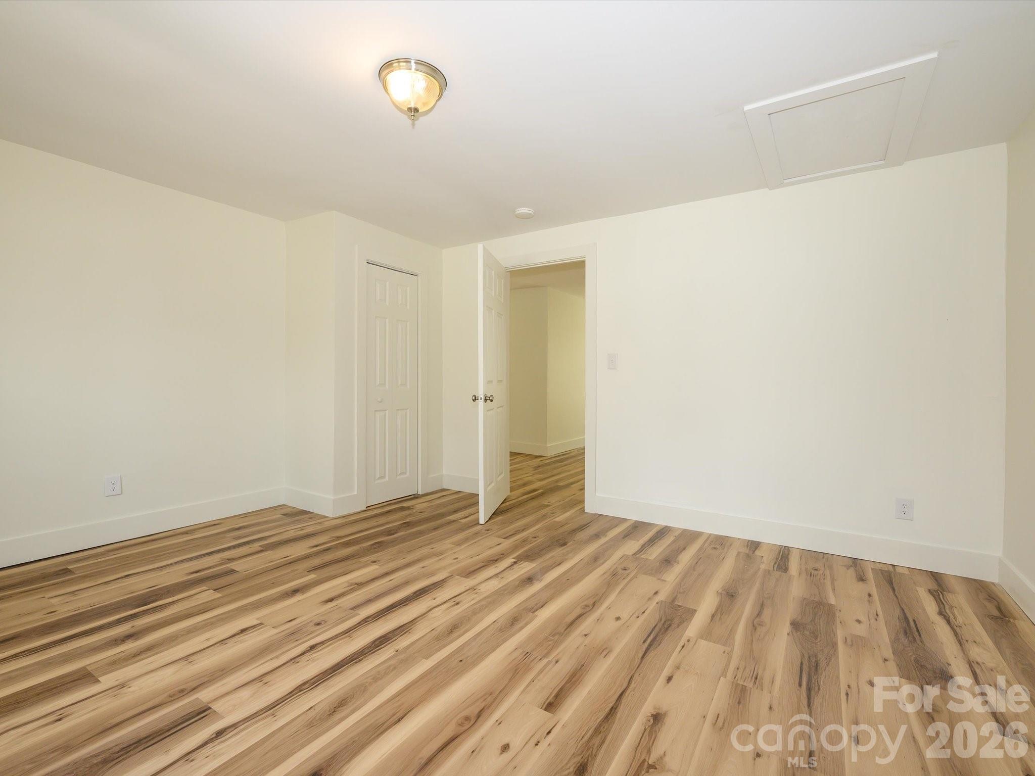 156 Hartsell School Road Southwest Concord, NC 28027 - Photo 22 of 28 a view of an empty room with wooden floor