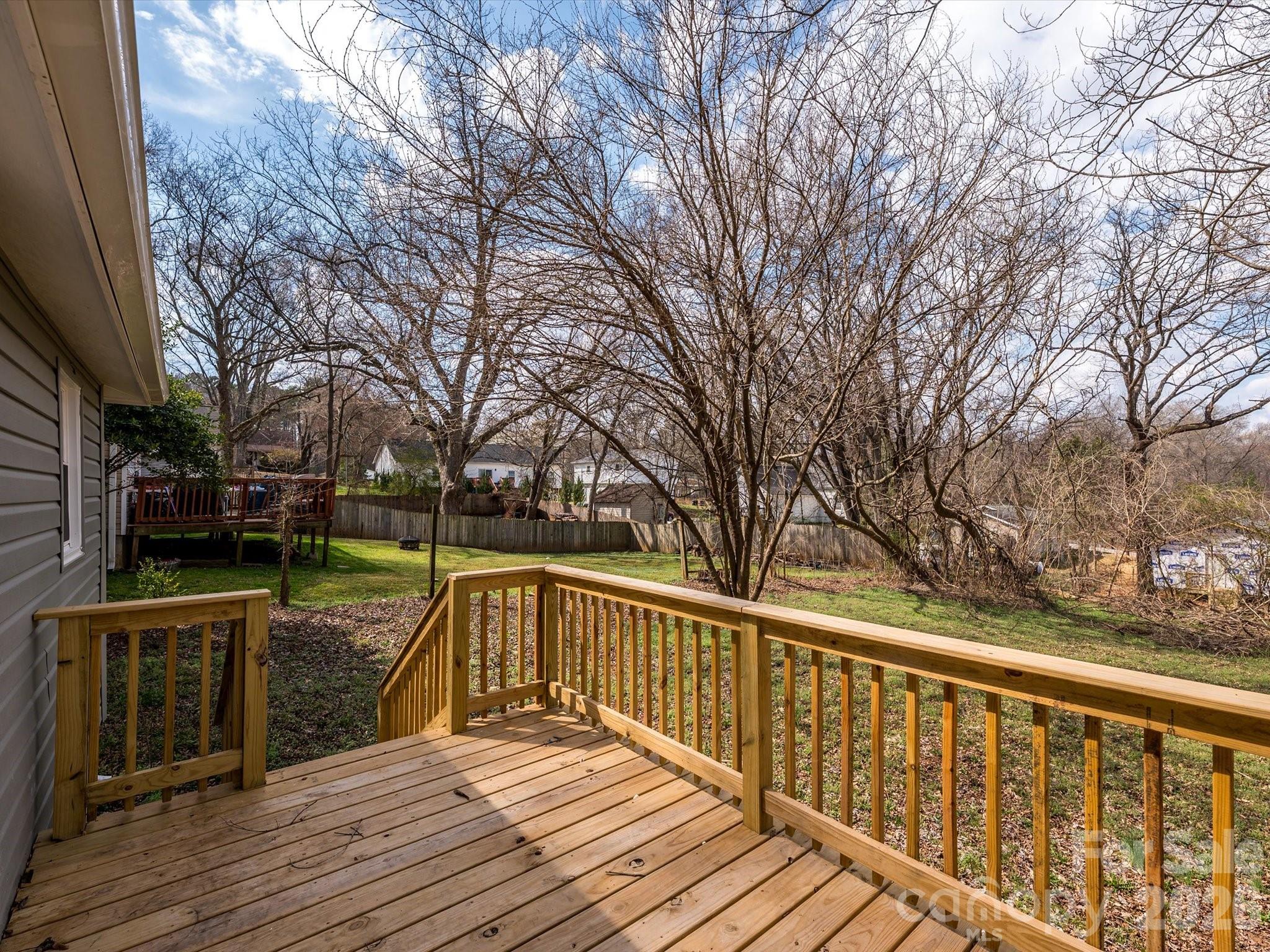 156 Hartsell School Road Southwest Concord, NC 28027 - Photo 25 of 28 a view of balcony with wooden floor and fence