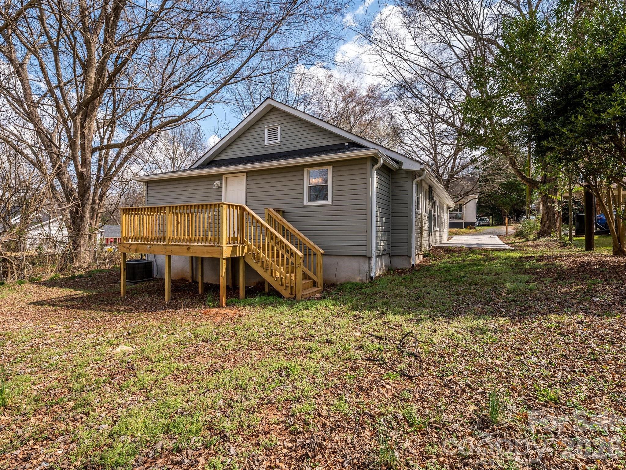156 Hartsell School Road Southwest Concord, NC 28027 - Photo 26 of 28 a view of a house with a yard