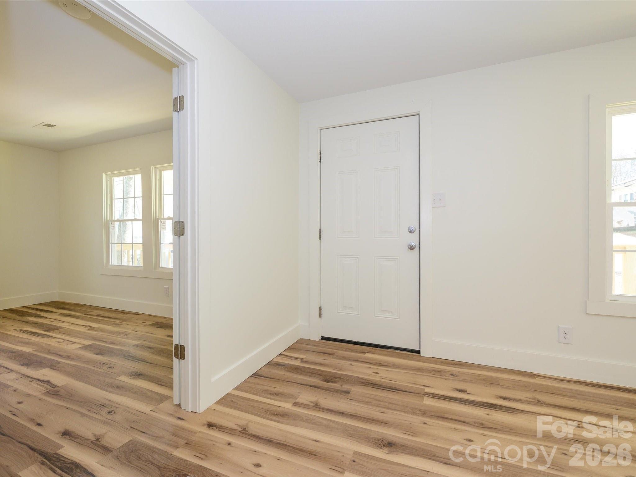156 Hartsell School Road Southwest Concord, NC 28027 - Photo 3 of 28 a view of a livingroom with wooden floor and window