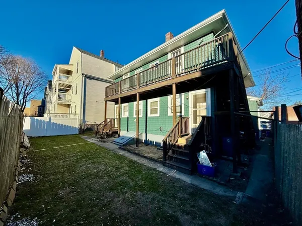 a view of backyard with deck