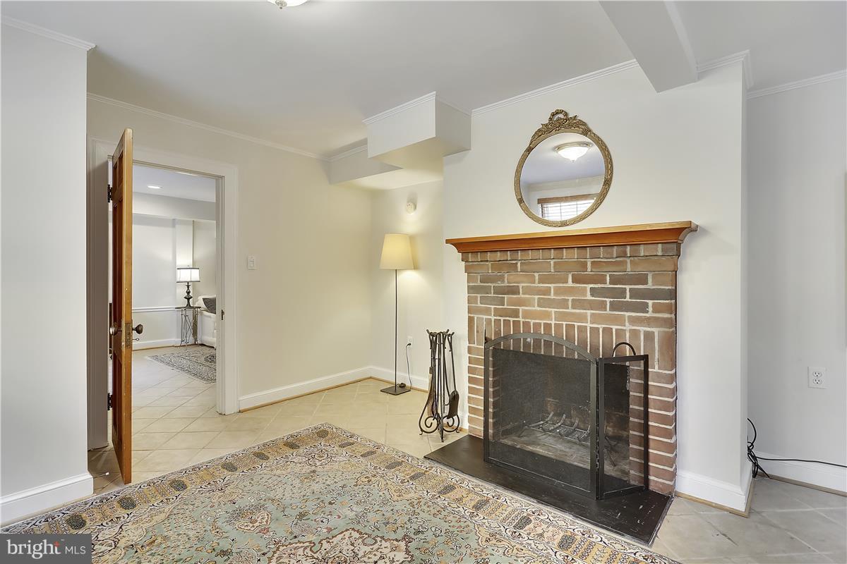 1600 Grace Church Road Silver Spring, MD 20910 - Photo 23 of 29 Lower level bedroom with romantic fireplace