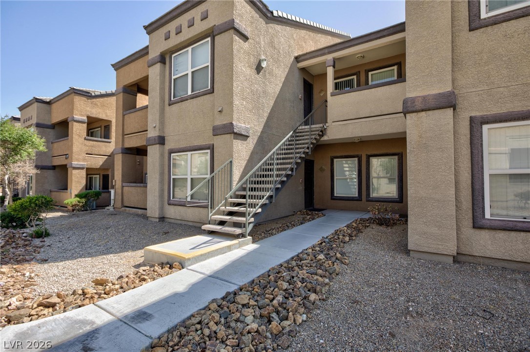6650 West Warm Springs Road, Unit 2027 Las Vegas, NV 89118 - Photo 4 of 29 This modern building features sleek design and inviting pathways for residents.