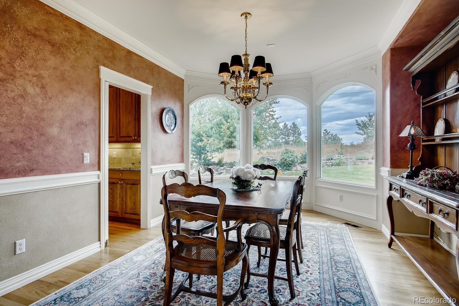 75 North Ranch Road Littleton, CO 80127 - Photo 16 of 33 a view of a dining room with furniture window and outside view