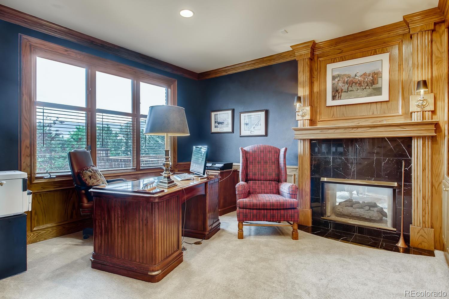 75 North Ranch Road Littleton, CO 80127 - Photo 18 of 33 a dining room with furniture and a fireplace