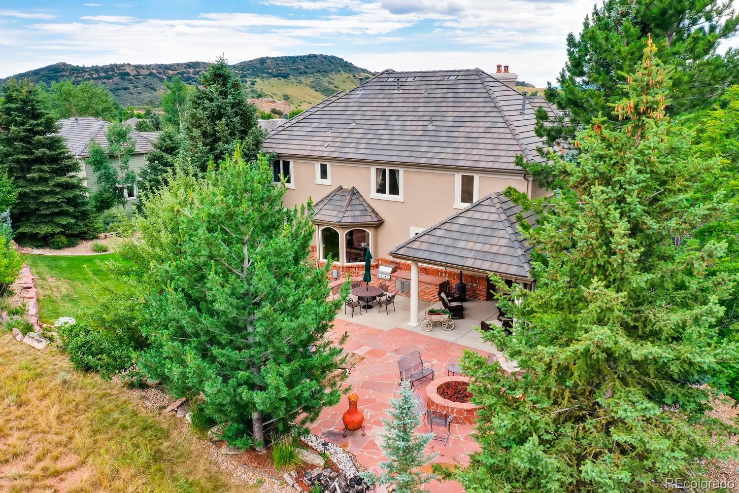 75 North Ranch Road Littleton, CO 80127 - Photo 2 of 33 a front view of a house with garden