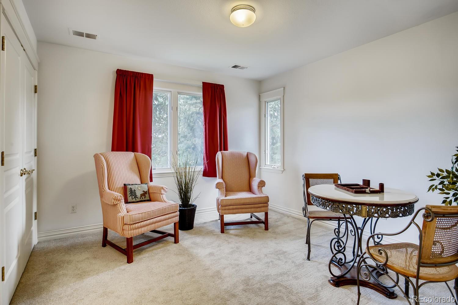 75 North Ranch Road Littleton, CO 80127 - Photo 24 of 33 a living room with furniture and a large window