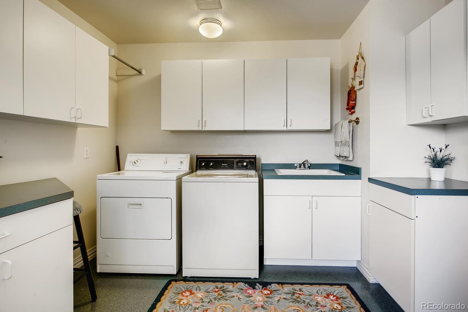 75 North Ranch Road Littleton, CO 80127 - Photo 29 of 33 a utility room with closet dryer and washer