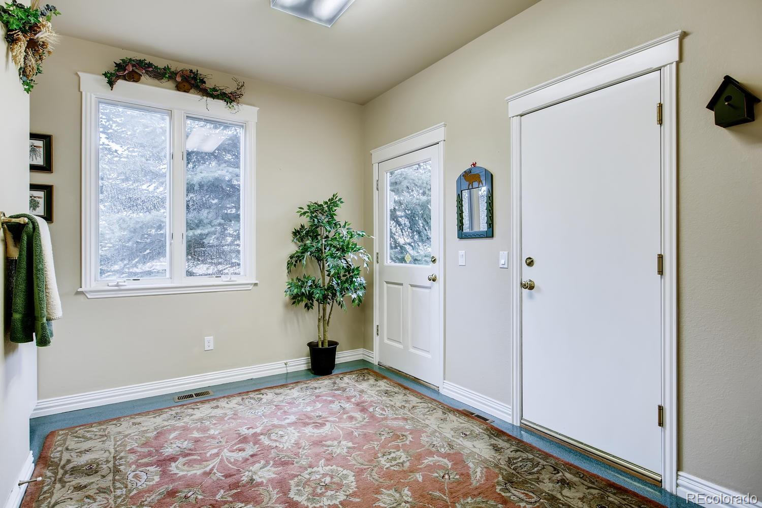 75 North Ranch Road Littleton, CO 80127 - Photo 31 of 33 a view of a bedroom with window and hallway