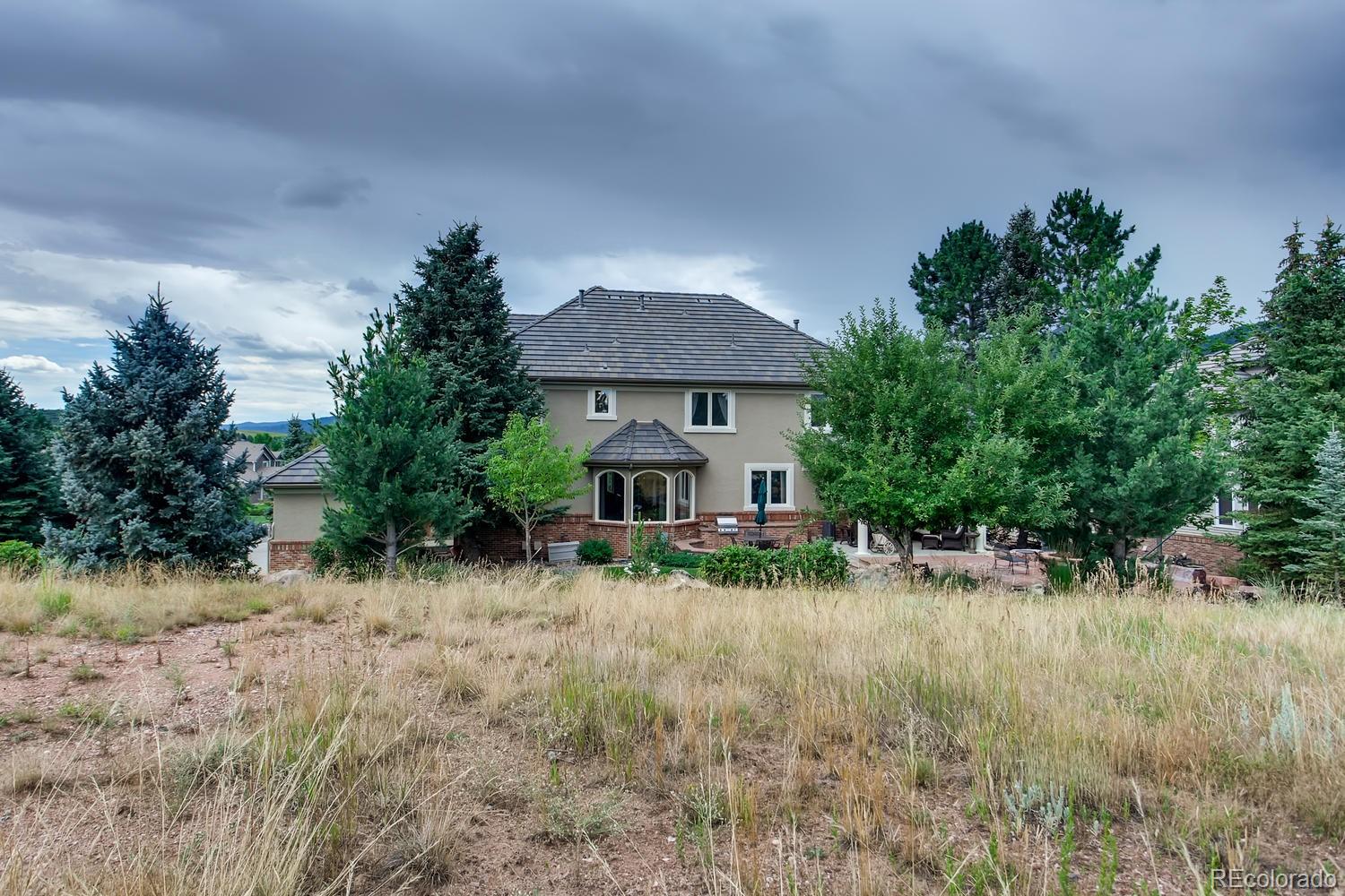 75 North Ranch Road Littleton, CO 80127 - Photo 5 of 33 a front view of a house with a yard