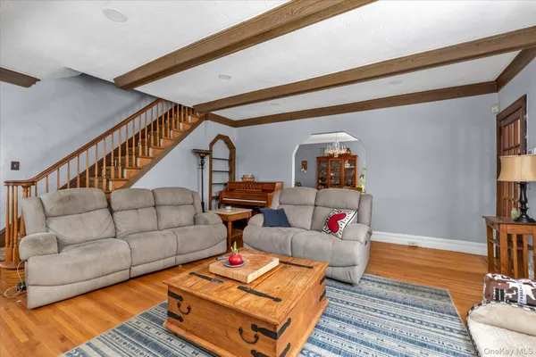 a living room with furniture and a rug