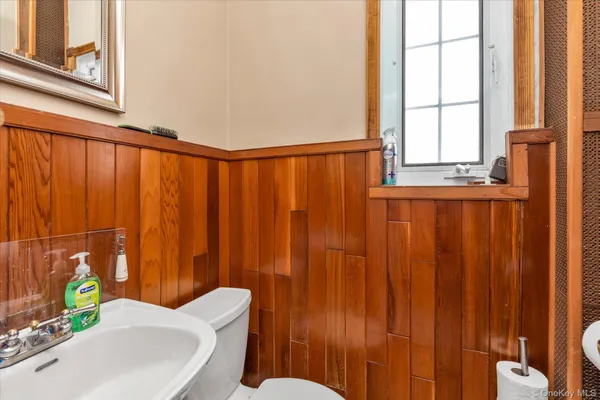 a bathroom with a sink a toilet and tub