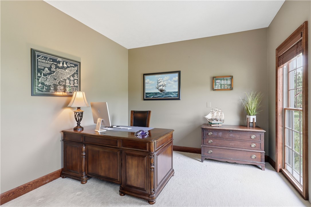 2057 Stirnie Road Victor, NY 14564 - Photo 17 of 48 Positioned quietly near the front entrance, the dedicated executive office offers the perfect work-from-home space, detailed with pristine trim work and abundant natural light