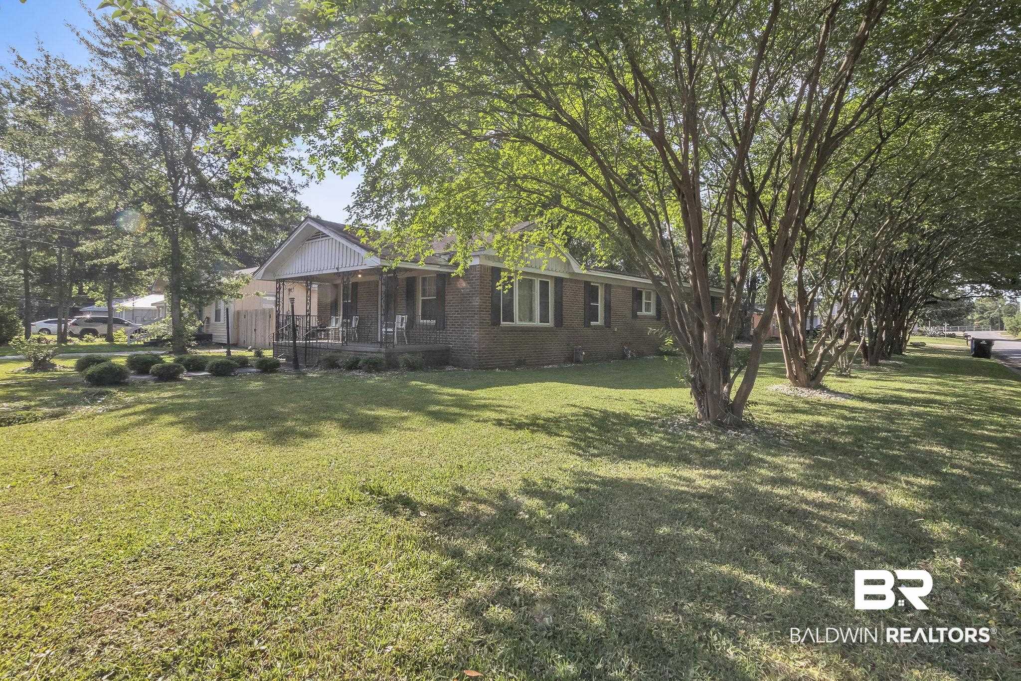 315 Fourth Avenue Chickasaw, AL 36611 - Photo 2 of 28 View of yard featuring covered porch