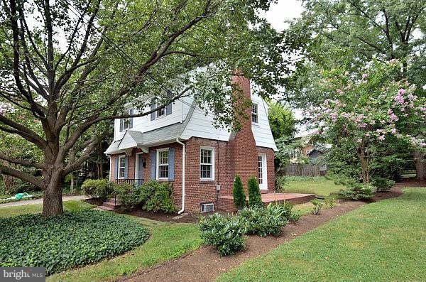 2423 Ridge Rd Drive Alexandria, VA 22302 - Photo 1 of 19 a front view of a house with a garden