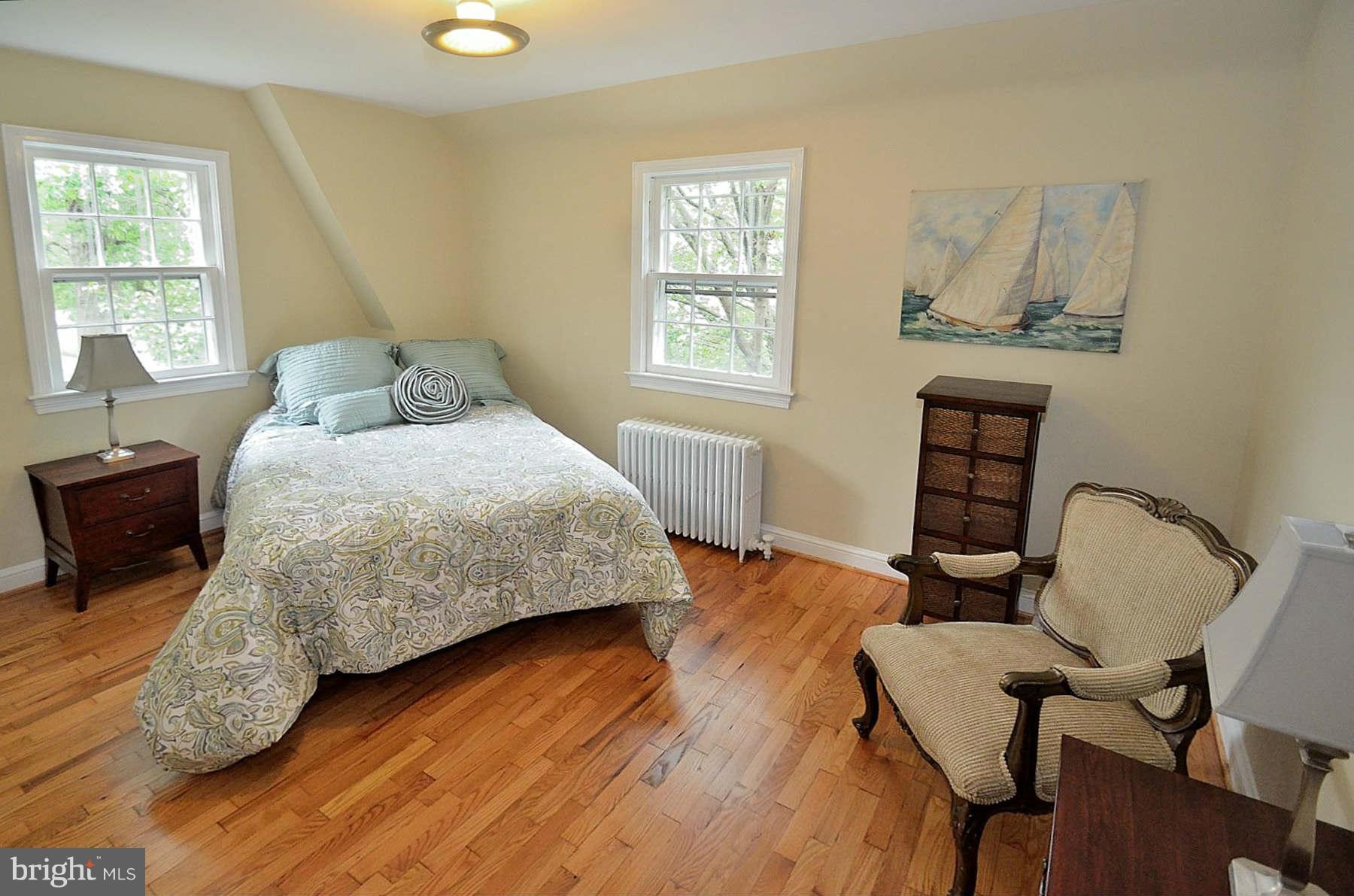 2423 Ridge Rd Drive Alexandria, VA 22302 - Photo 11 of 19 a bedroom with a bed chair and a window