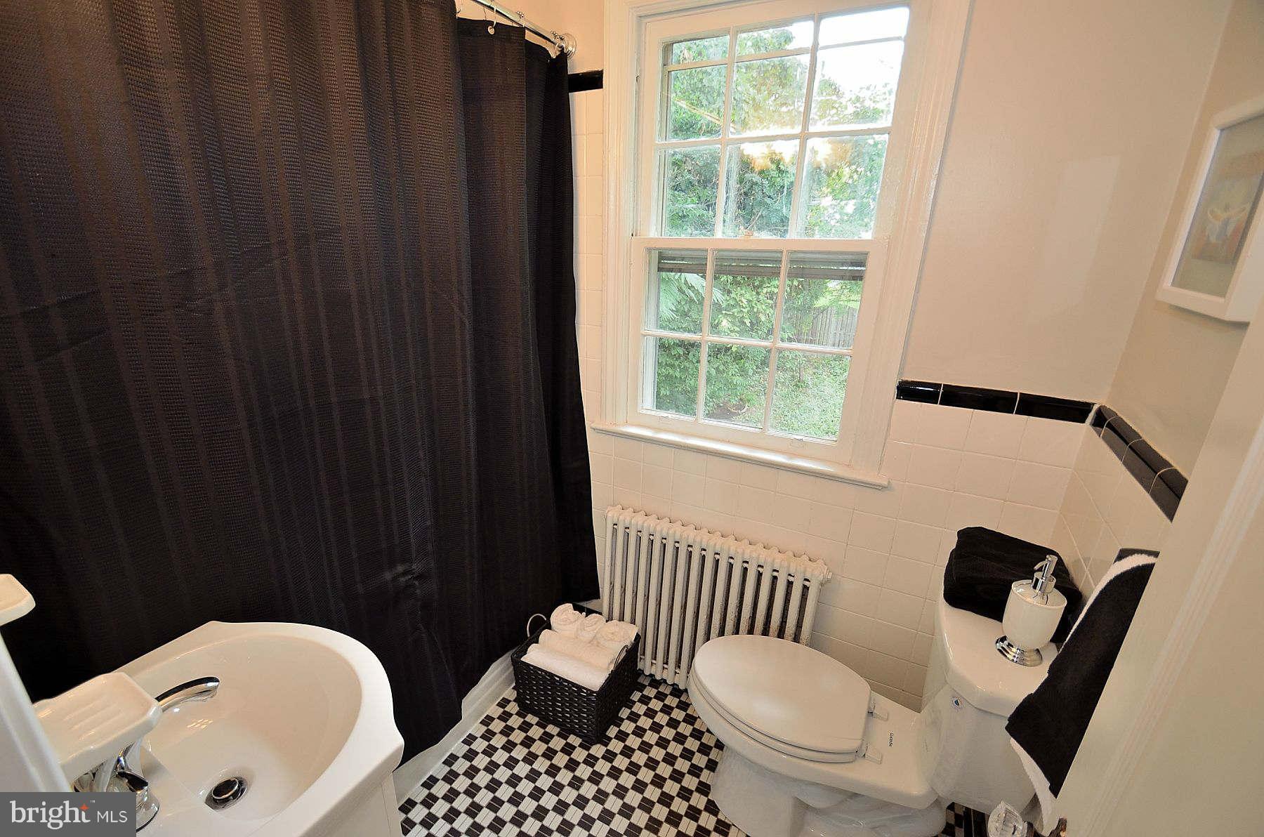 2423 Ridge Rd Drive Alexandria, VA 22302 - Photo 13 of 19 a bathroom with a sink and a toilet