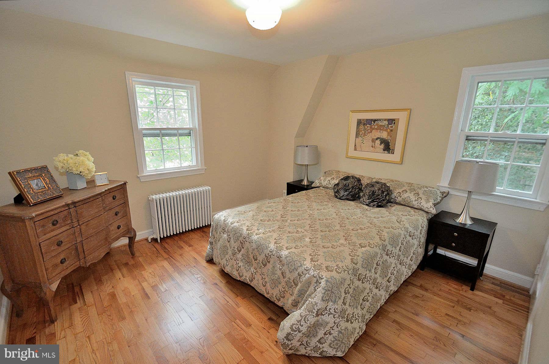 2423 Ridge Rd Drive Alexandria, VA 22302 - Photo 10 of 19 a bedroom with a bed and wooden floor